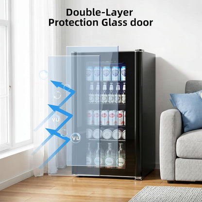 A compact black beverage refrigerator with a transparent double-layer glass door, shown in a bright living room setting with a sofa and window. Blue graphic arrows and the text 'Double-Layer Protection Glass door' illustrate the glass feature.