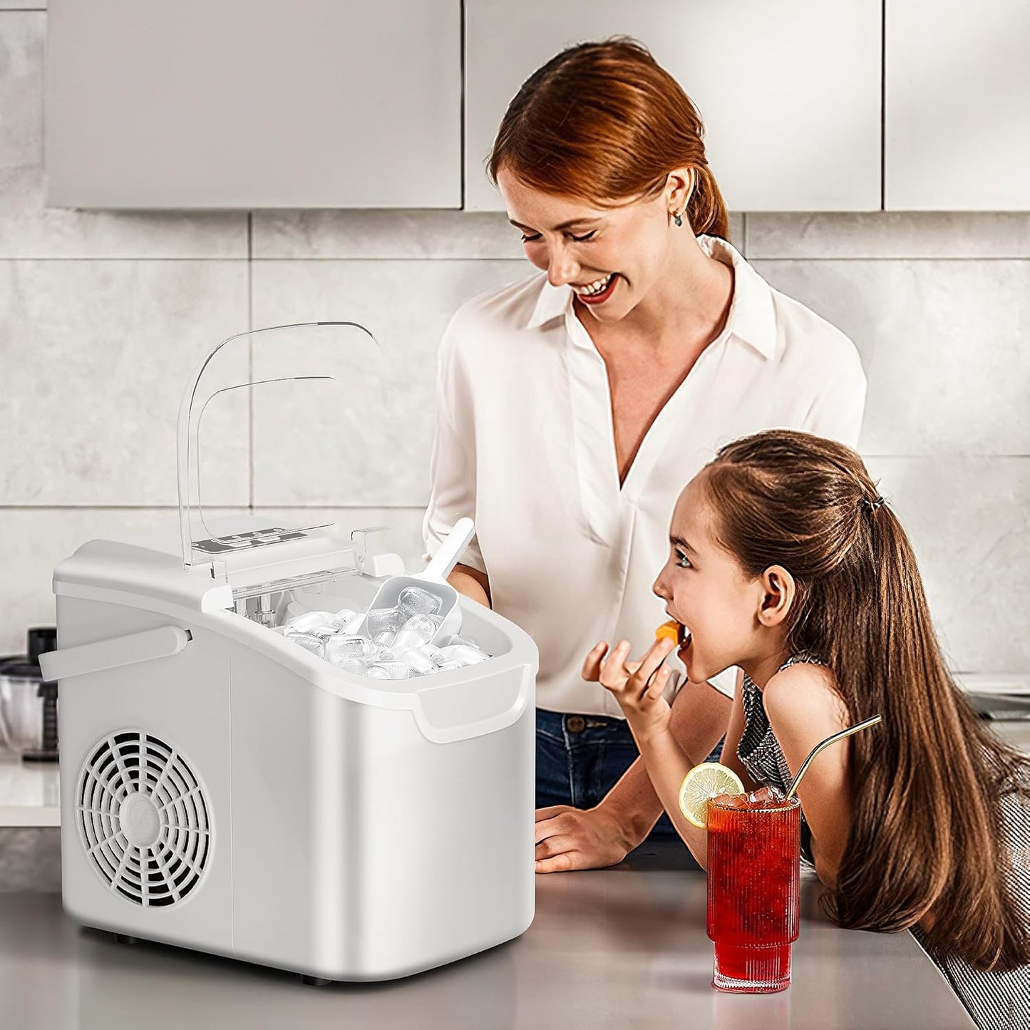 Woman and child in a kitchen with an ice maker and drinks.