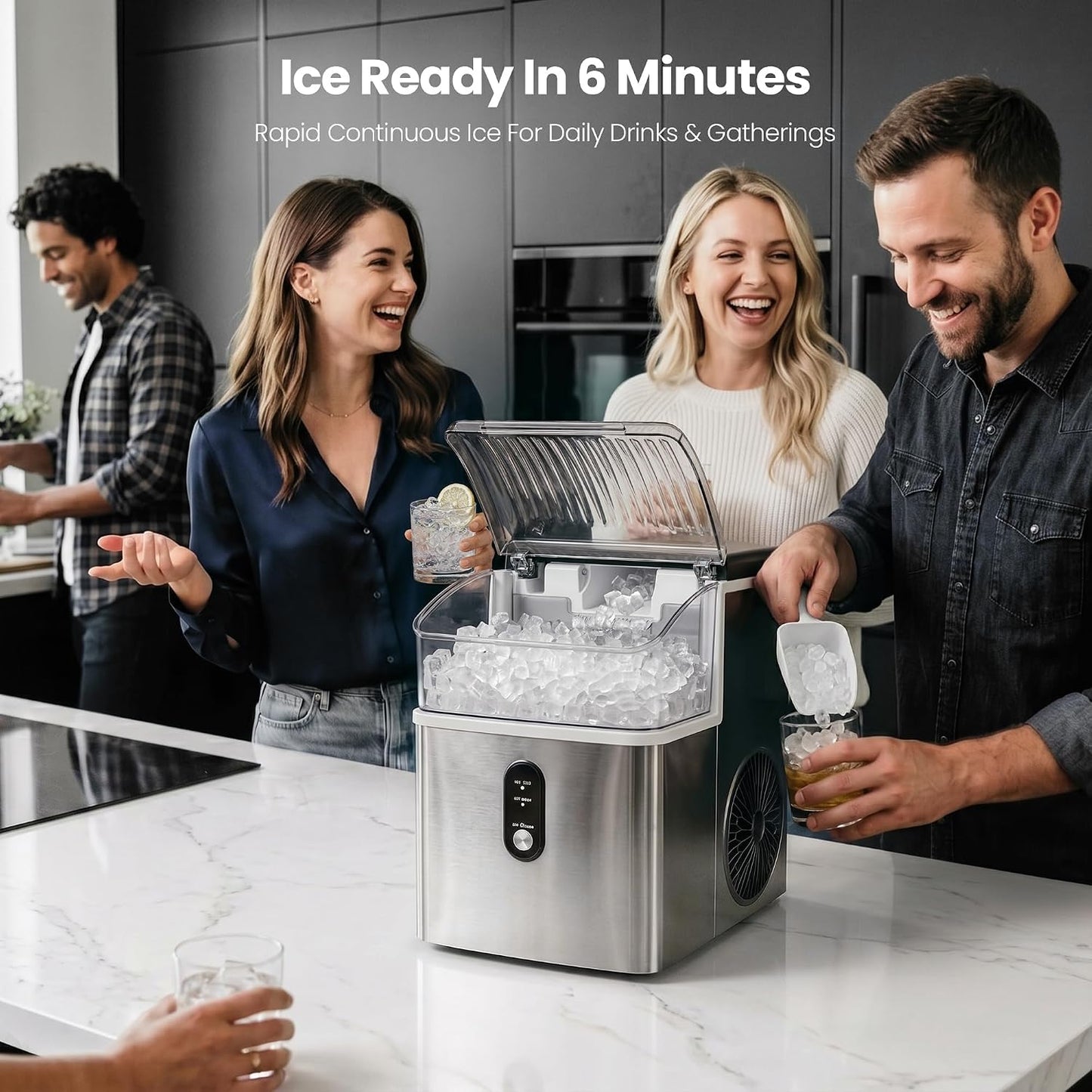 A stainless steel ice maker on a white marble kitchen counter, shown with three people making ice in a modern kitchen setting. Text at the top reads 'Ice Ready In 6 Minutes'.