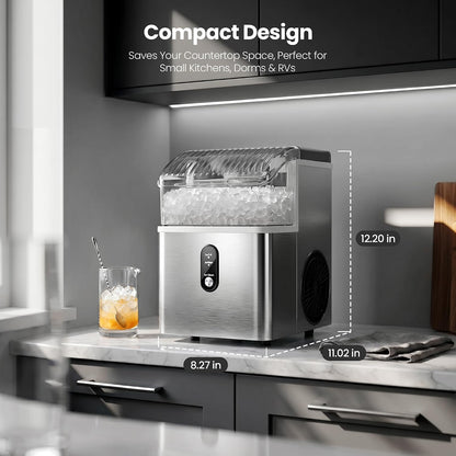 A compact stainless steel ice machine sits on a kitchen countertop with overlaid dimension labels showing 8.27 in width, 11.