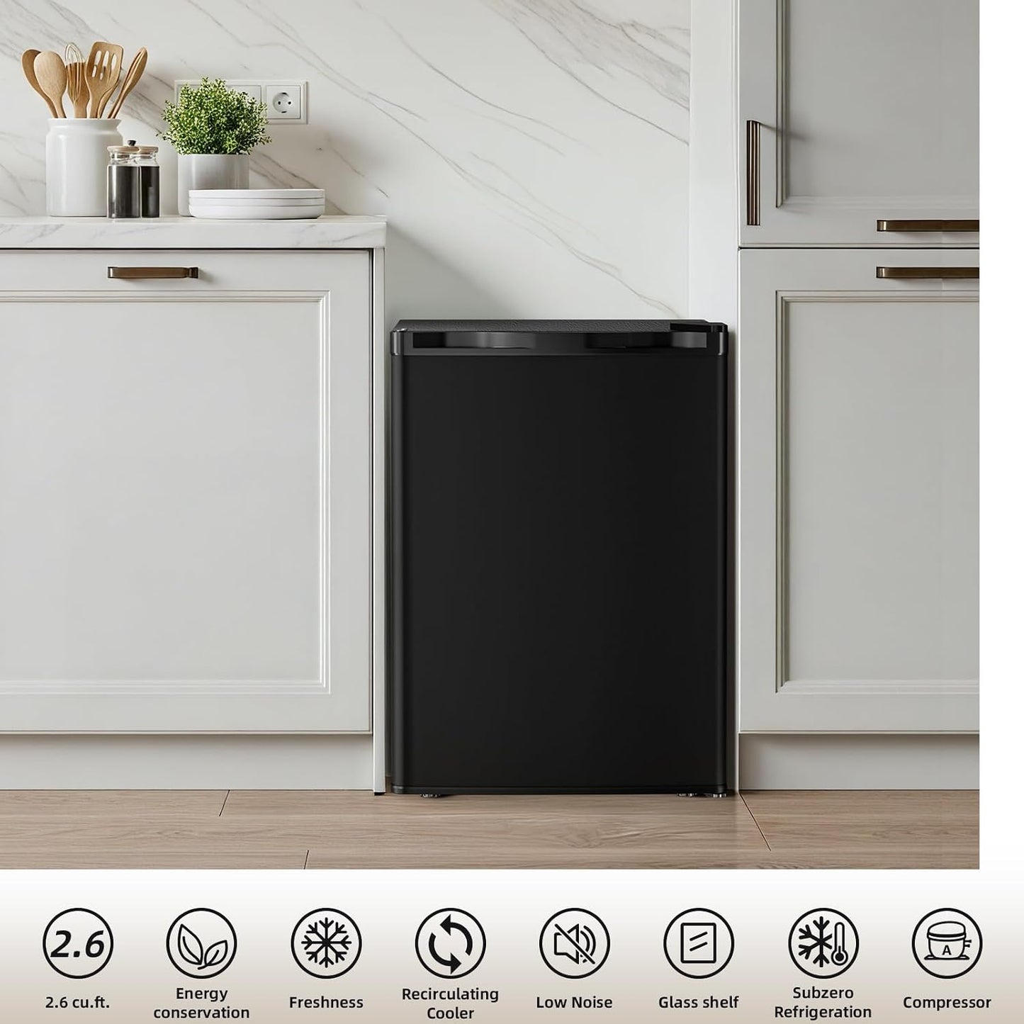 A black countertop refrigerator shown in a modern kitchen setting with white cabinets and marble-look backsplash. A white information strip at the bottom lists features such as 2.