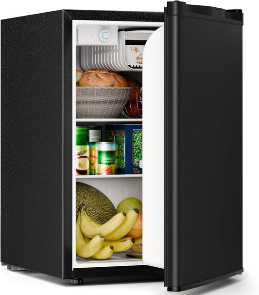 Black mini refrigerator with food items inside on a white background